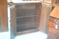Lot 330 - A George I walnut bureau cabinet, the top with...