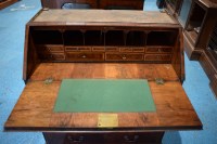 Lot 330 - A George I walnut bureau cabinet, the top with...