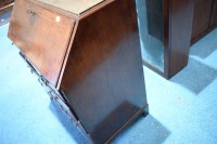Lot 330 - A George I walnut bureau cabinet, the top with...