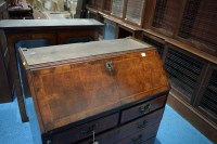 Lot 330 - A George I walnut bureau cabinet, the top with...