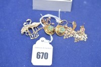 Lot 670 - A pair of 9ct. yellow gold earrings set with...