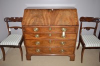 Lot 1293 - A George III mahogany bureau, the fall-flap...