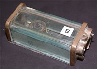 Lot 177 - A bronze and glass gauge glass stamped "A.P."...