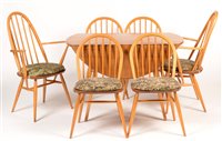 Lot 1072 - Ercol: a light elm and beechwood drop leaf table; and six chairs.