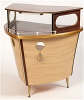 Lot 1096 - Umberto Mascagni, Bologna, Italy : a mid 20th Century boat form cocktail bar.