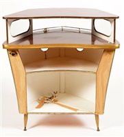 Lot 1096 - Umberto Mascagni, Bologna, Italy : a mid 20th Century boat form cocktail bar.