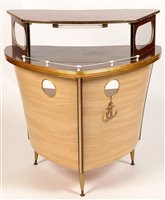 Lot 1096 - Umberto Mascagni, Bologna, Italy : a mid 20th Century boat form cocktail bar.