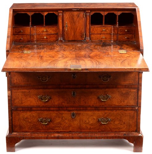 Lot 948 - A George I burr walnut and banded bureau.