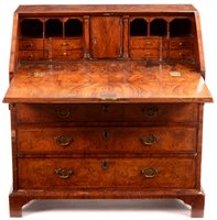 Lot 948 - A George I burr walnut and banded bureau.