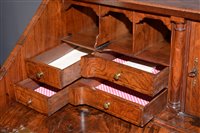 Lot 948 - A George I burr walnut and banded bureau.