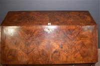 Lot 948 - A George I burr walnut and banded bureau.