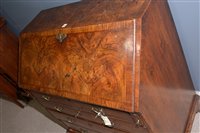 Lot 948 - A George I burr walnut and banded bureau.