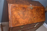 Lot 948 - A George I burr walnut and banded bureau.