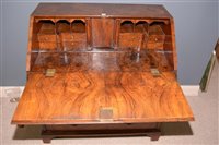 Lot 948 - A George I burr walnut and banded bureau.