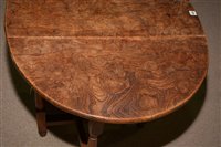 Lot 1015 - An Elm drop leaf table