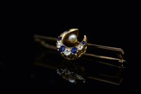 Lot 730 - Sapphire and diamond crescent brooch