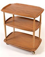 Lot 1095 - Ercol three-tier tea trolley.