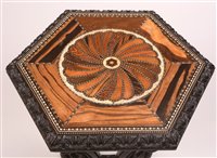 Lot 967 - A 19th Century Singhalese carved ebony and calamander specimen occasional table.