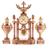 Lot 927 - A French three-piece clock garniture.
