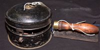 Lot 209 - A Victorian bread rasp, with turned wooden handle; together with a 19th Century tole ware nutmeg jar, with central grater.