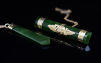 Lot 712 - Nephrite pendant & brooch.