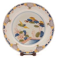 Lot 105 - A mid 18th Century London Delftware charger.