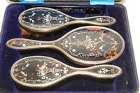 Lot 579 - A silver and inlaid tortoise shell dressing table set