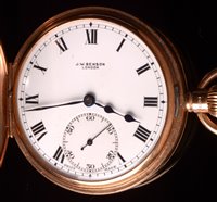 Lot 700 - A George V 9ct. gold crown wind half hunter pocket watch.