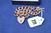Lot 211 - A curb link bracelet.