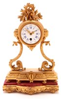 Lot 931 - A star burst pendulum clock.