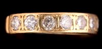 Lot 737 - Seven stone diamond ring