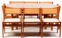 Lot 1122 - A dining table and eight chairs.