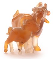 Lot 42 - An early 20th Century Chinese carved agate group of a goat and kid.