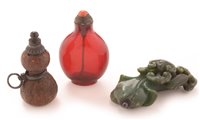 Lot 57 - A 19th Century Chinese amber glass snuff bottle