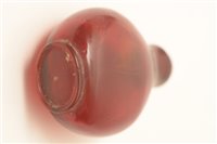 Lot 57 - A 19th Century Chinese amber glass snuff bottle