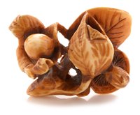 Lot 53 - Japanese carved and stained ivory netsuke