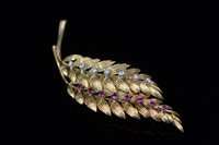 Lot 714 - Ruby and diamond leaf brooch