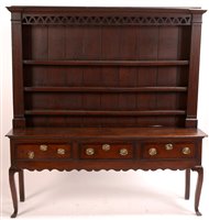 Lot 1014 - An oak and mahogany banded dresser
