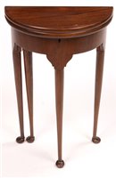 Lot 1018 - A demi lune occasional table.