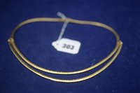 Lot 303 - Yellow metal necklace