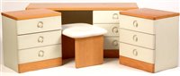 Lot 1099 - An oak effect and melamine dressing table and stool, and a pair of matching three drawer chests.