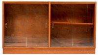 Lot 1085 - Manner of Gordon Russell: a mid 20th Century walnut glazed bookcase.