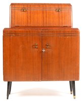 Lot 1102 - Rivington: a mid 20th Century walnut cocktail cabinet