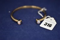 Lot 316 - Opal and 9ct gold bangle
