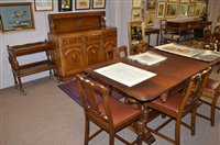 Lot 700 - A nine-piece dining room suite.