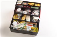 Lot 57 - A Black and Red fishing tackle box containing a variety of lures