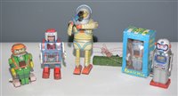Lot 1051 - Five tin plate astronauts