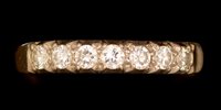 Lot 486 - Diamond half eternity ring