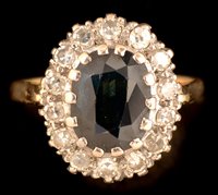 Lot 578 - Sapphire and diamond cluster ring