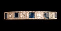 Lot 555 - Sapphire and diamond ring